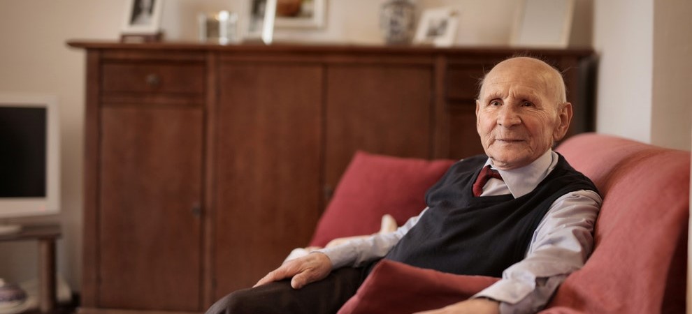 Elderly Man Sitting in an Armchair